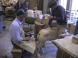 Justin holding his horse still while Bud drills a hole for the tail!  OUCH!